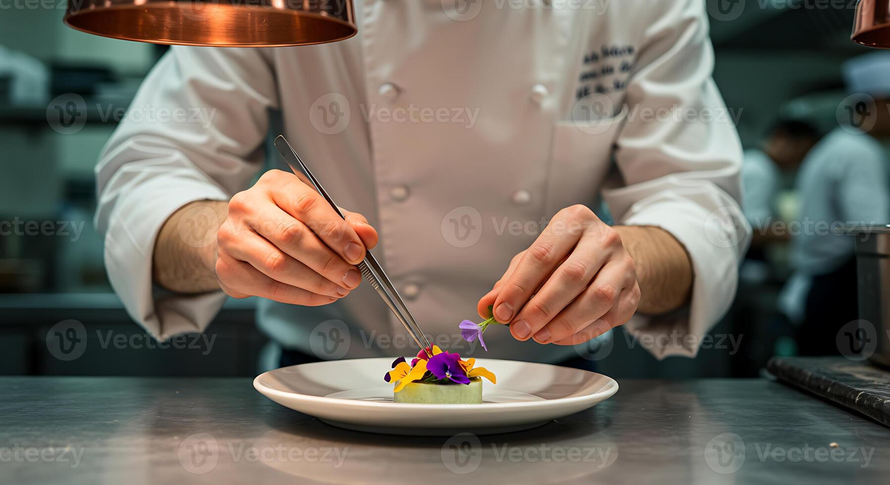 A chef is preparing food on a plate photo