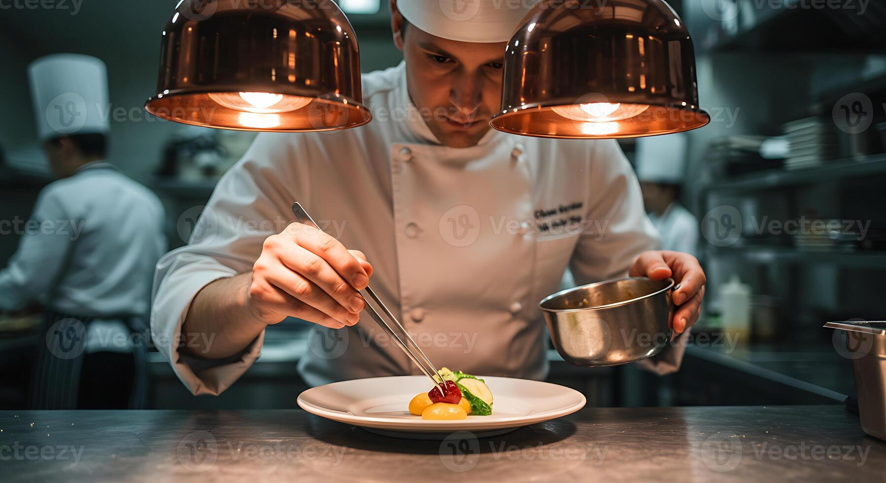 Chef Plating Dish with Tweezers in Commercial Kitchen photo