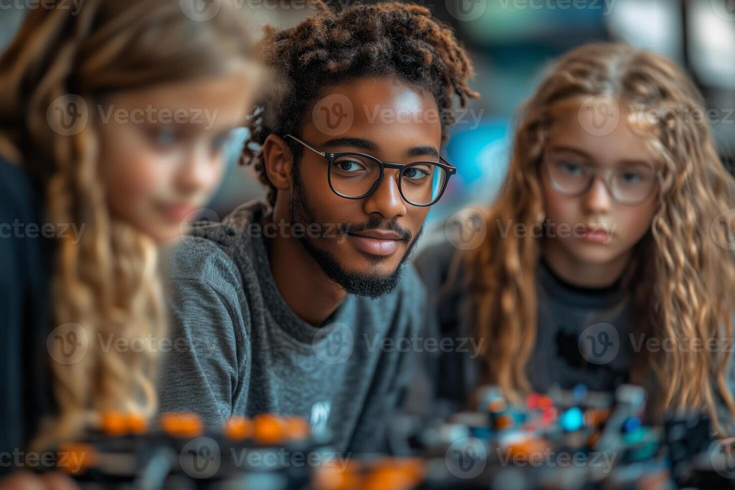 a diverse group of students collaborating with a teacher on a STEM project, robotics equipment on the table, colorful classroom photo