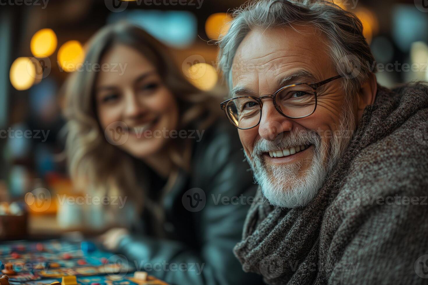 a group of elderly friends enjoying a board game night at home, laughing and engaged, with snacks and drinks on the table photo