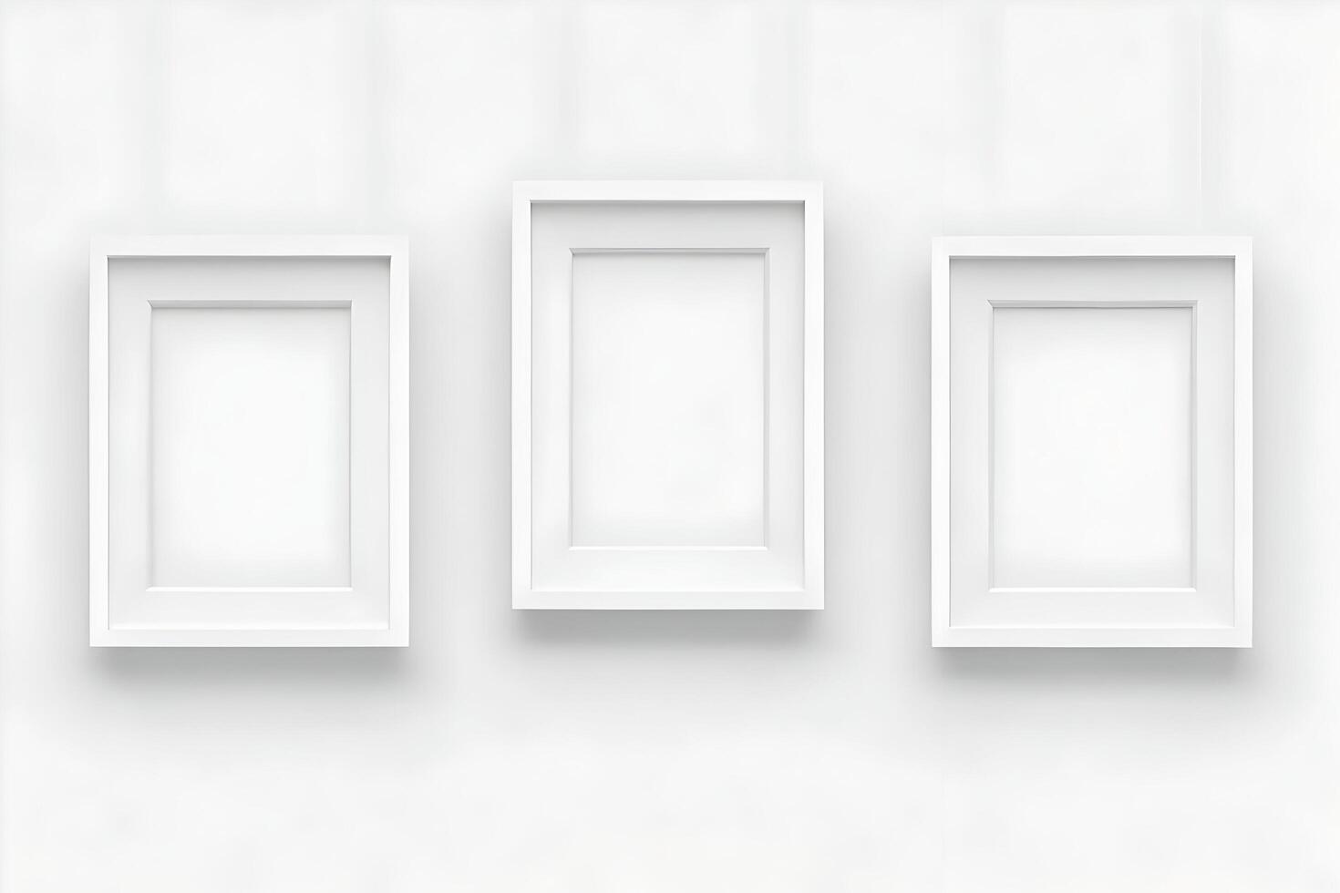 Elegant minimalist design featuring three white picture frames against a bright wall photo