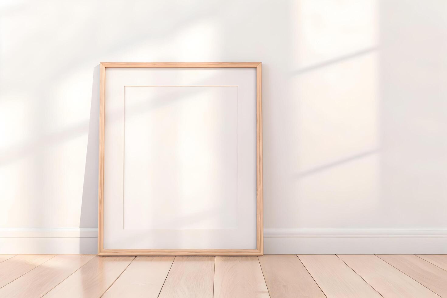 Elegant blank frame mockup leaning against a wall with soft sunlight casting shadows photo