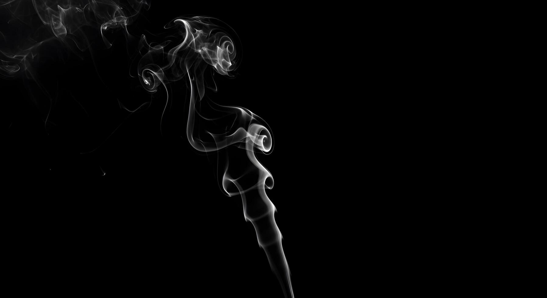 Ethereal tendrils of vapor dance against a stark, black canvas creating an abstract form photo
