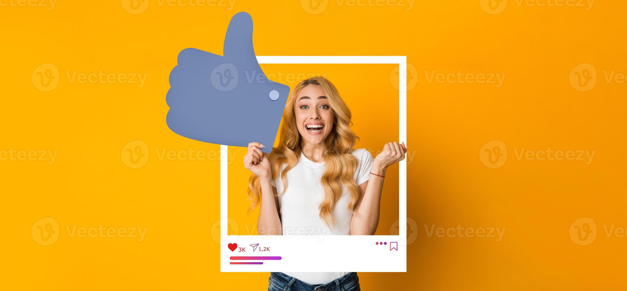 A young woman excitedly expresses joy by giving a thumbs up in front of a bright yellow background. Her enthusiastic pose captures the essence of social media engagement and inspiration. photo