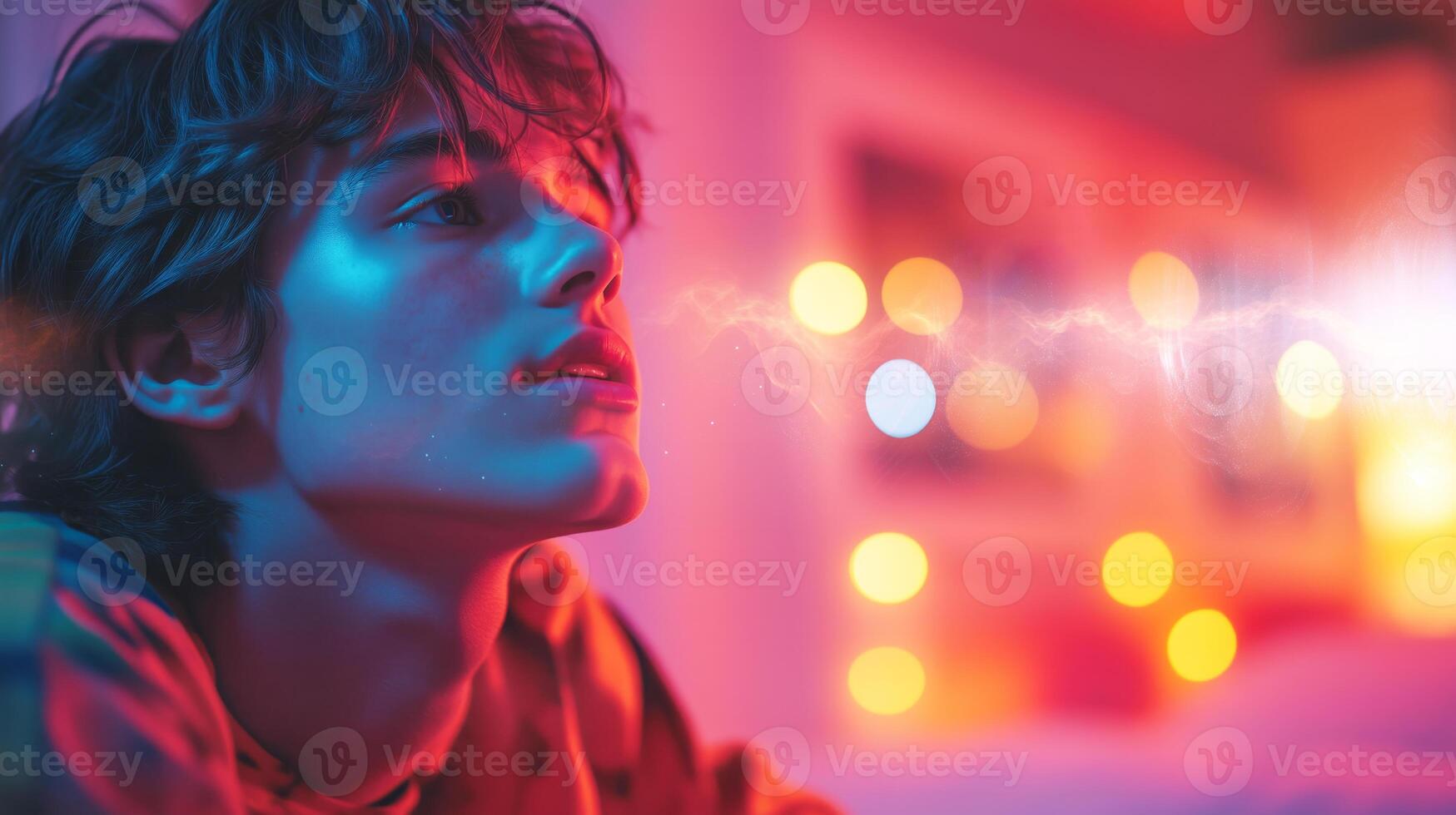 A man and a woman engage in a creative session, using voice control and sound graphics. The cozy room is illuminated by colorful lights, enhancing their collaborative atmosphere. photo