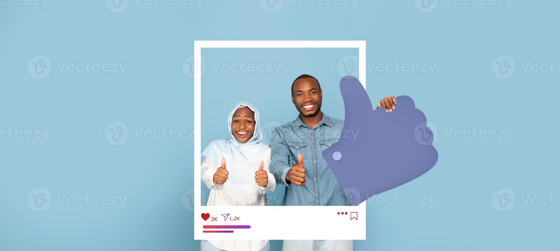 Two individuals stand together, smiling and giving thumbs up against a soft blue background. They are showcasing an uplifting moment typical of social media influencers sharing positive vibes. photo