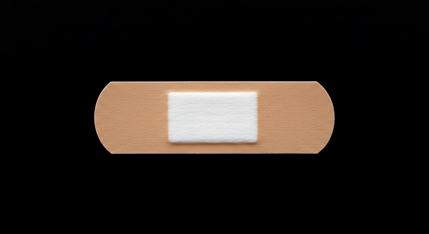 A bandage with a square patch on it photo