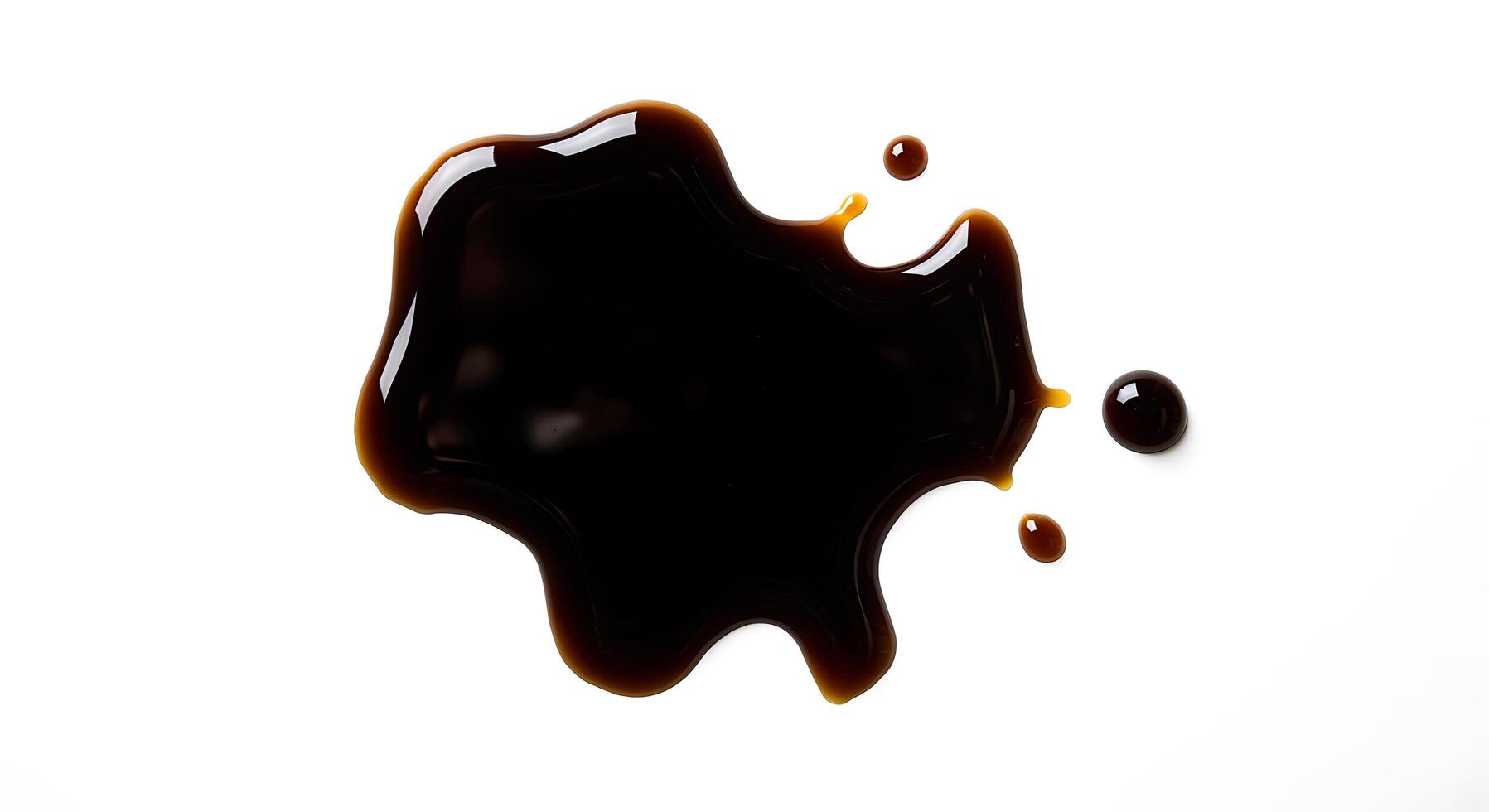 A brown liquid is being poured into a white surface photo