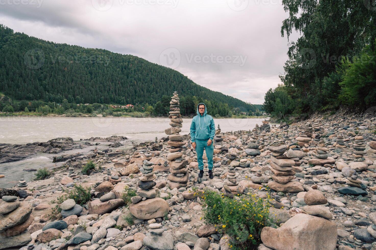 Man at the river Katun at summer day. Trip on Altai Mountains in Altai Republic photo