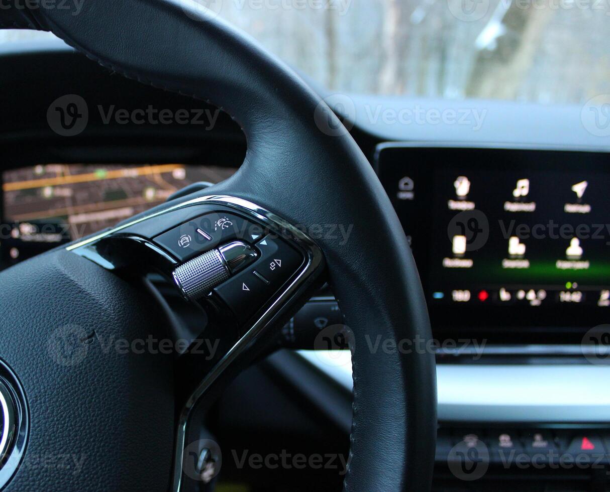 Speed Limiter Mode And Collision Avoidance System Buttons On A Steering Wheel With Blurred Monitor With Menu Icons In Modern Car photo