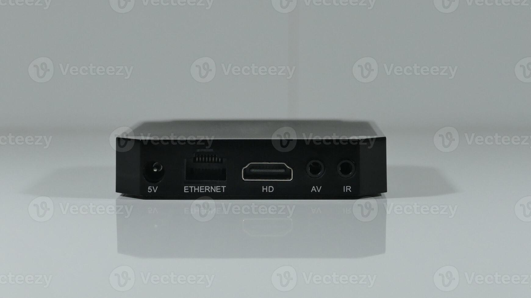 The back panel of a set top box with different connectors and slots for connection photo