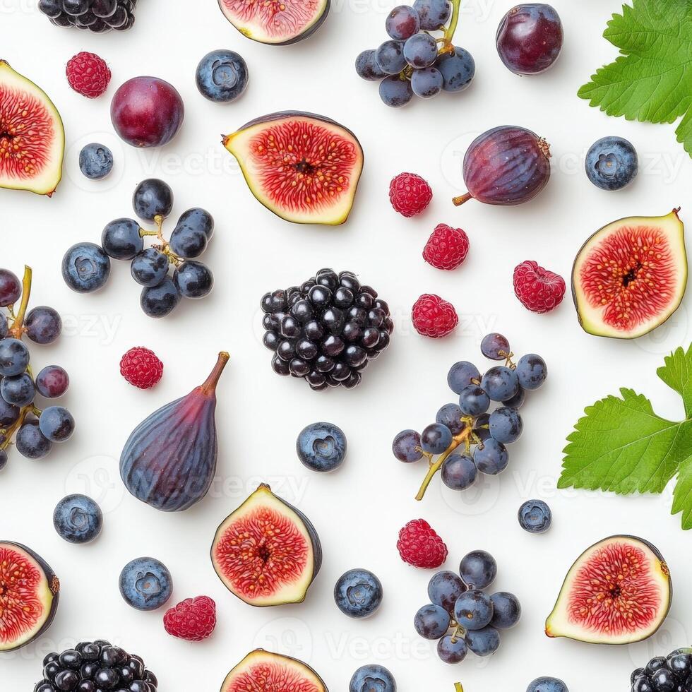 Flat lay of various berries and figs including blackberries, raspberries, blueberries, and sliced figs on a white background, creating a vibrant and textured fruit composition photo