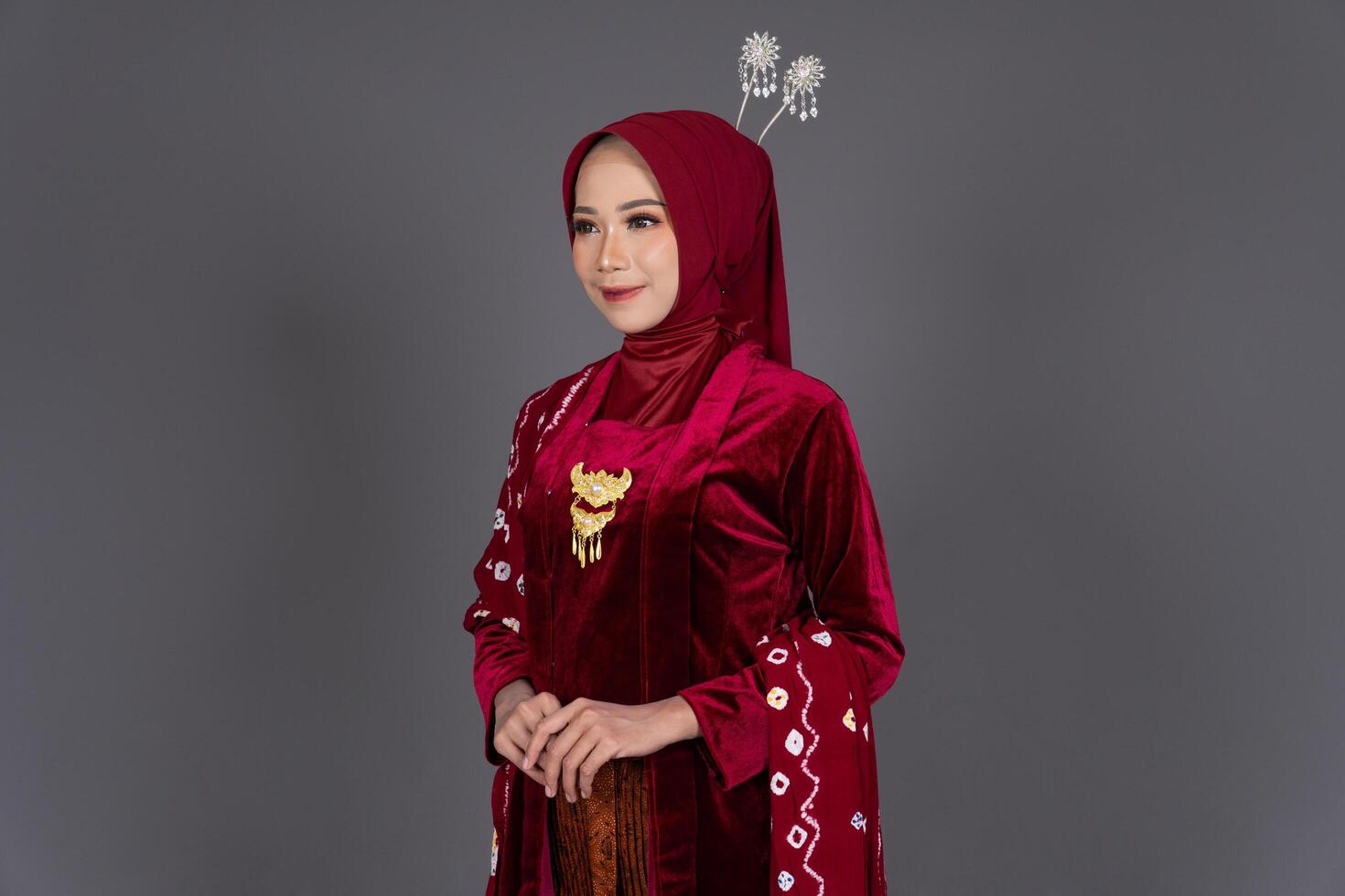 Smiling Hijab Woman Wearing Elegant Kebaya photo