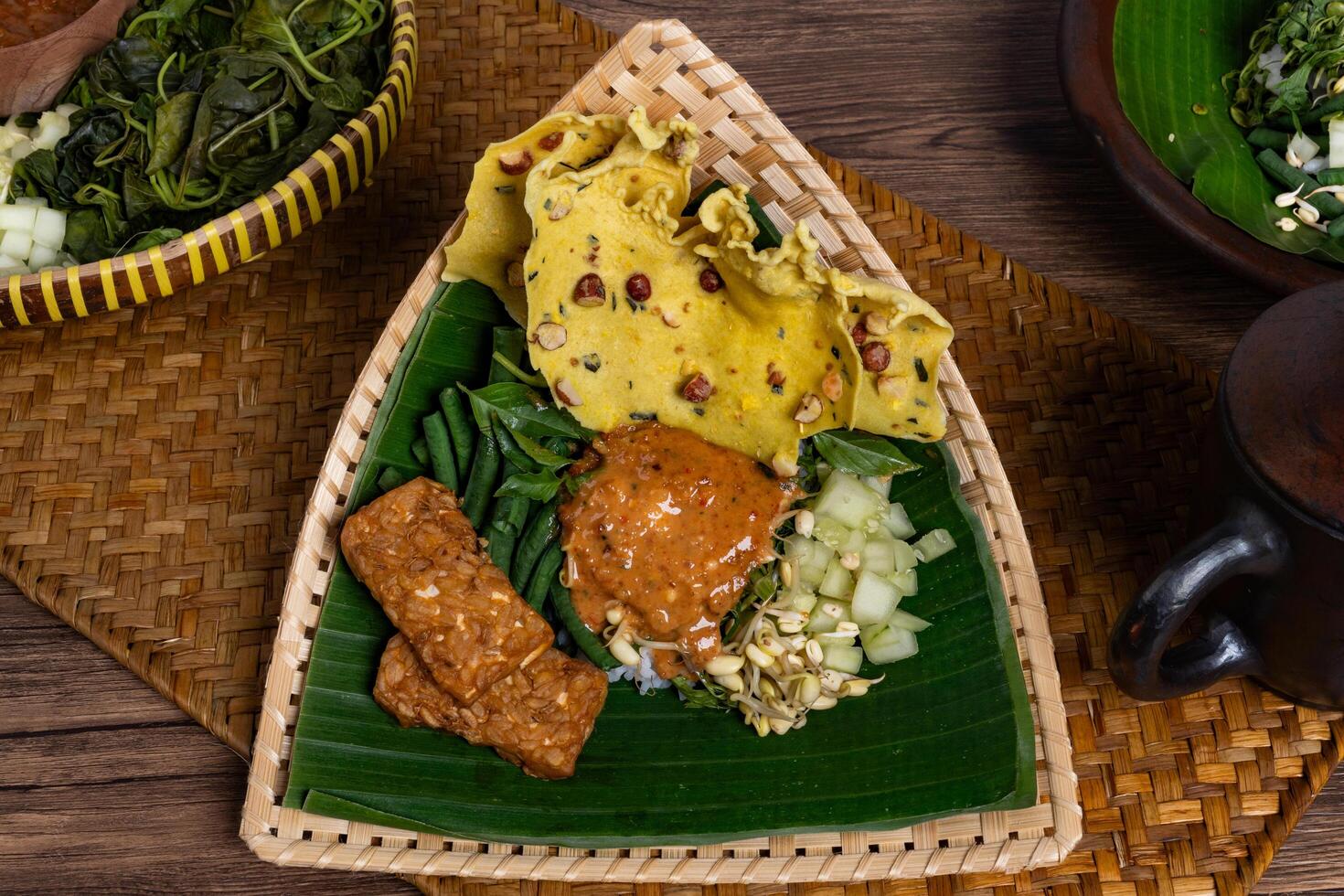 Authentic Javanese Pecel in Triangular Bamboo Plate Isolated photo