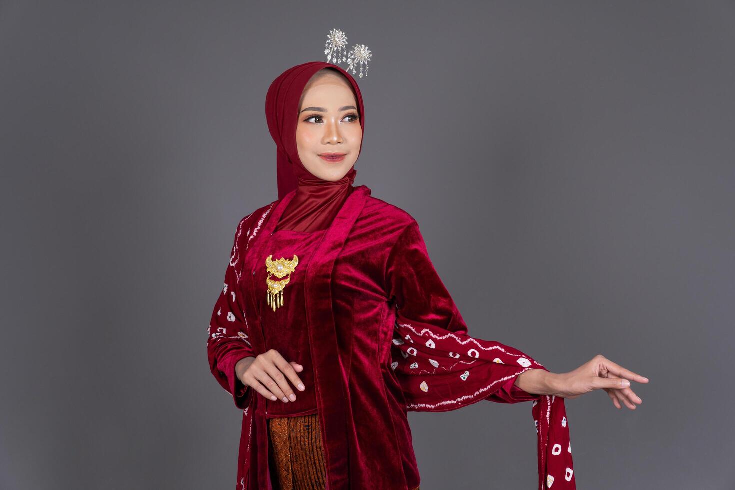 Smiling Hijab Woman Wearing Elegant Kebaya Traditional Background photo