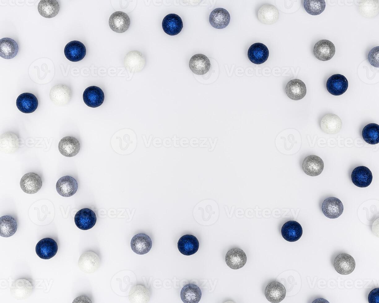 Christmas frame with sparkly blue and silver Christmas balls. New Year decorative border for holiday wishes photo