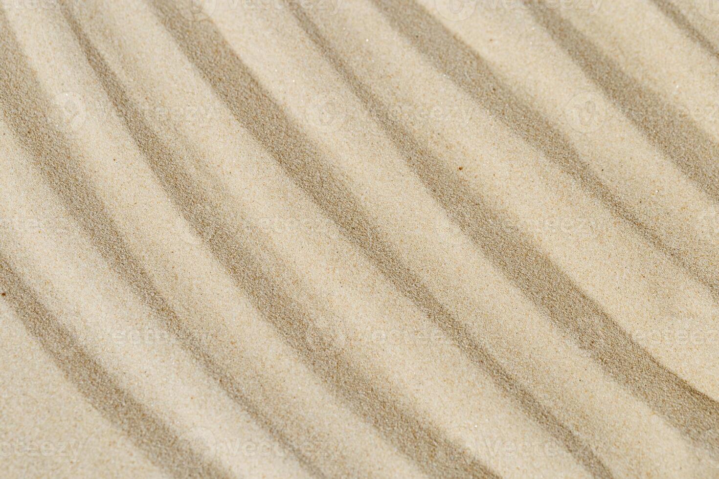 Lines drawing on sand, beautiful sandy texture. Spa background, concept for meditation and relaxation photo