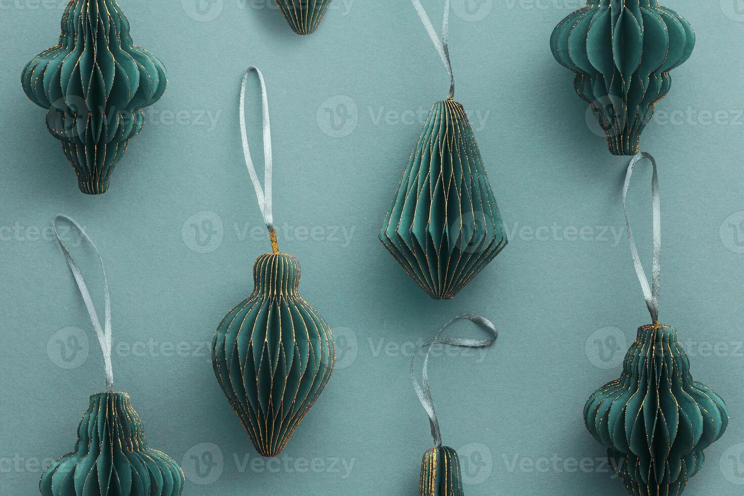 Minimal Top view dark green teal Christmas paper flashlights, winter festive layout copy space background, vivid color tree toy with Golden glitters. Merry Christmas and New year holidays pattern photo