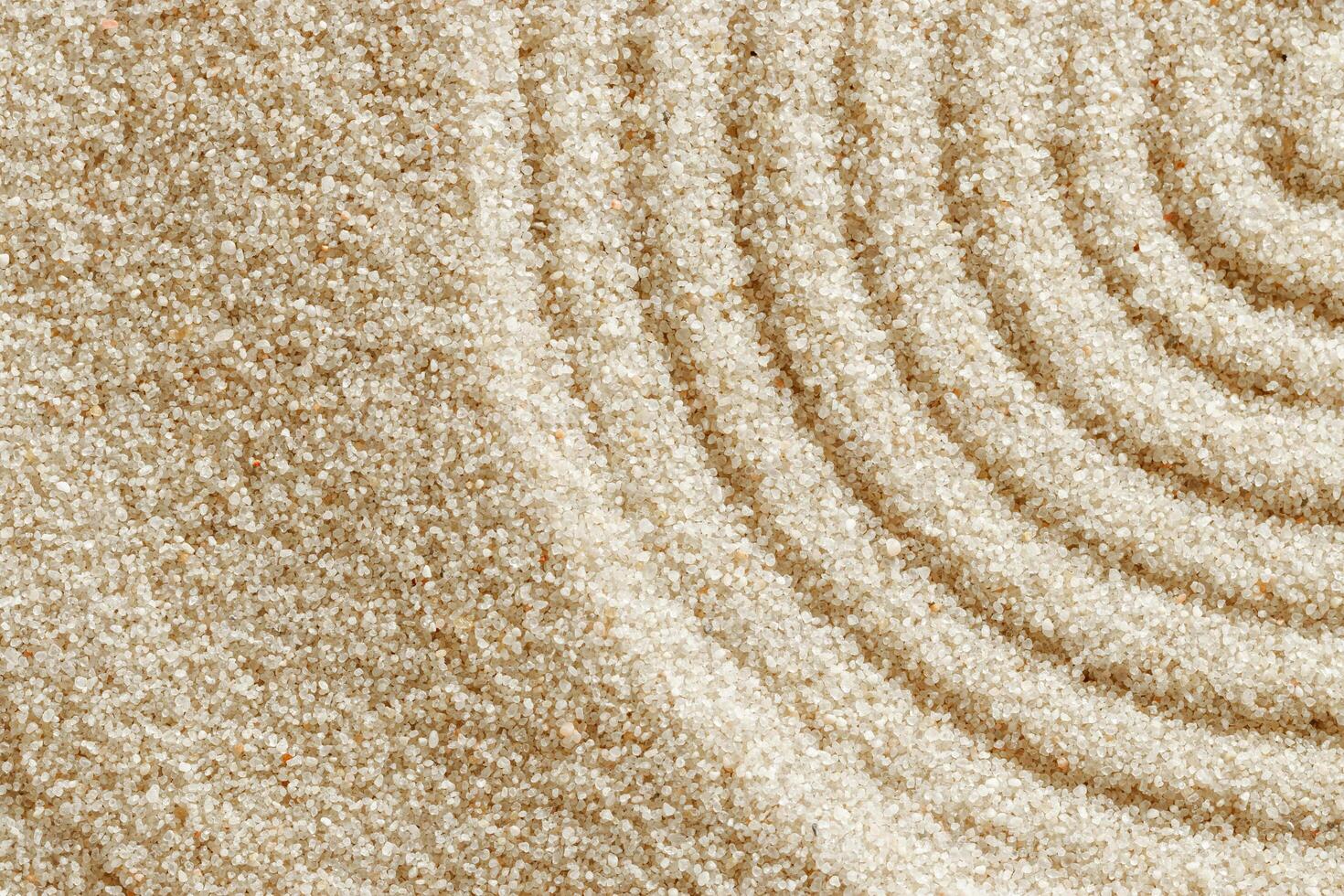Smooth simple Lines on sand background, minimal aesthetic sandy texture. Spa, meditation, relaxation, wellness concept. Natural beige waves pattern in Japanese zen garden. View from above photo