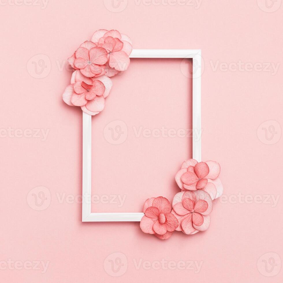 Plain natural Hydrangea flowers, minimal floral style pastel pink blossom arrangement. Flowery frame photo