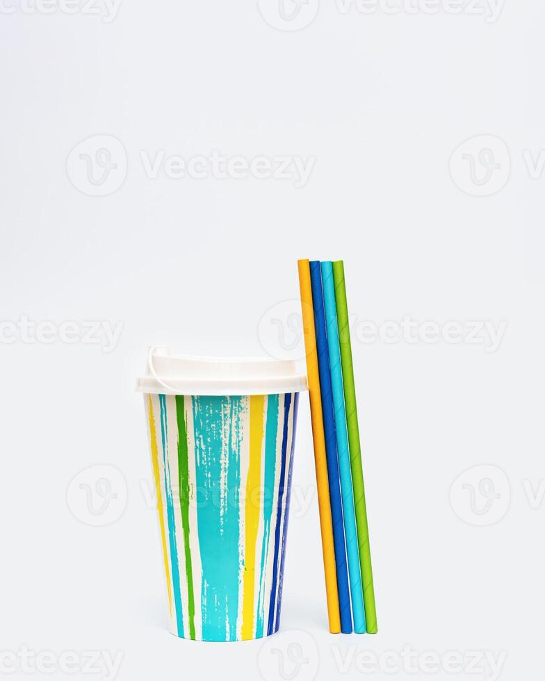 Colorful paper cup or container for coffee, cocktail and paper drinking straws Bright summer package for beverage. photo