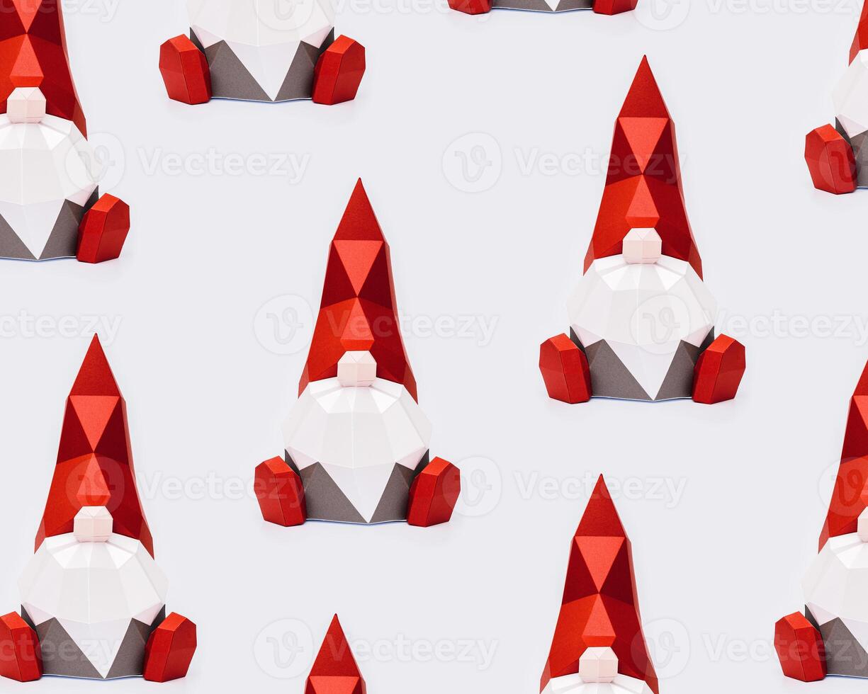 Volumetric paper Christmas gnomes in red pointed hat on light background, polygonal figure dwarf photo