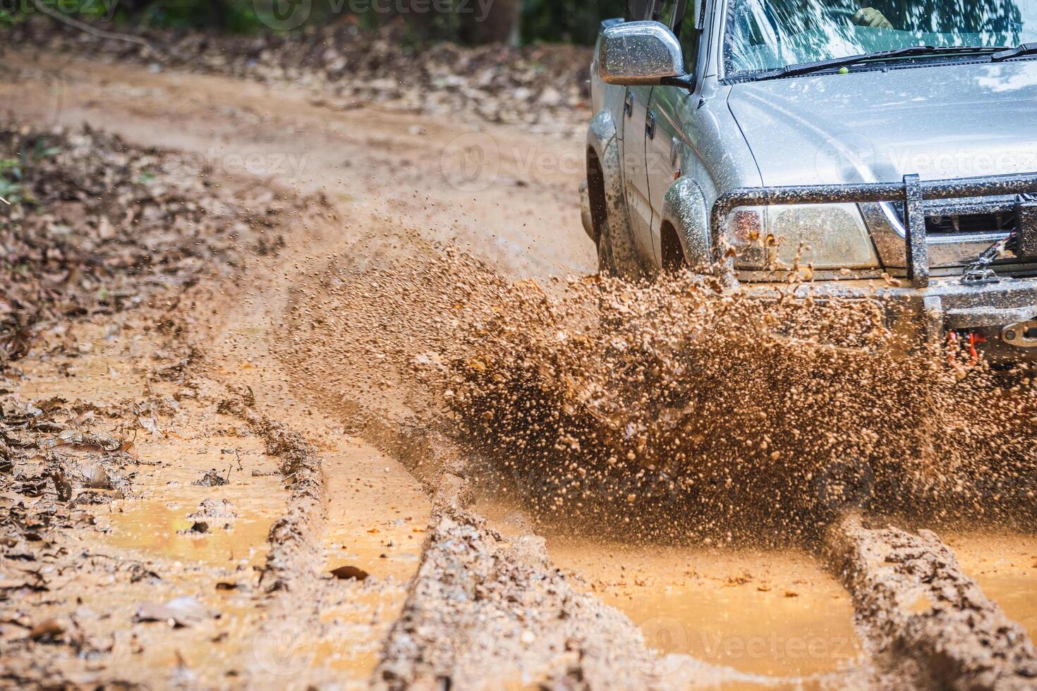 Offroad car. 4x4 off-road suv car stuck in mud photo