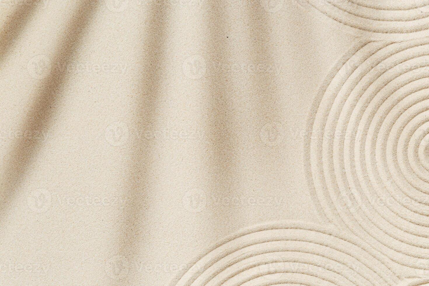 Concentration and spirituality in zen garden lines drawing in sand and shadows of palm leaves photo