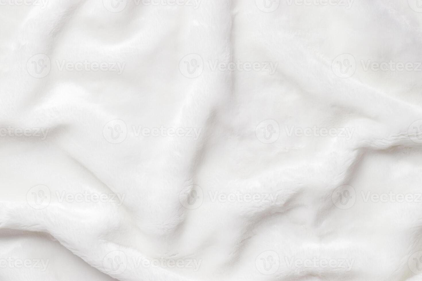 White Faux Fur Texture, Soft, white artificial fur with fluffy texture and gentle shadows. Close-up textile background delicate textures, top view, copyspace, backdrop with soft folds photo