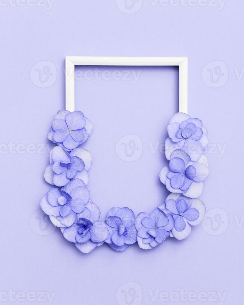 Plain natural Hydrangea flowers, minimal floral style pastel violet blossom arrangement. Flowery frame photo