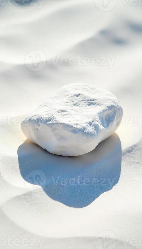 A white rock on a white sand, strong shadows, bright sunny day, minimalist, clean, symmetrical composition, centered, studio shot photo