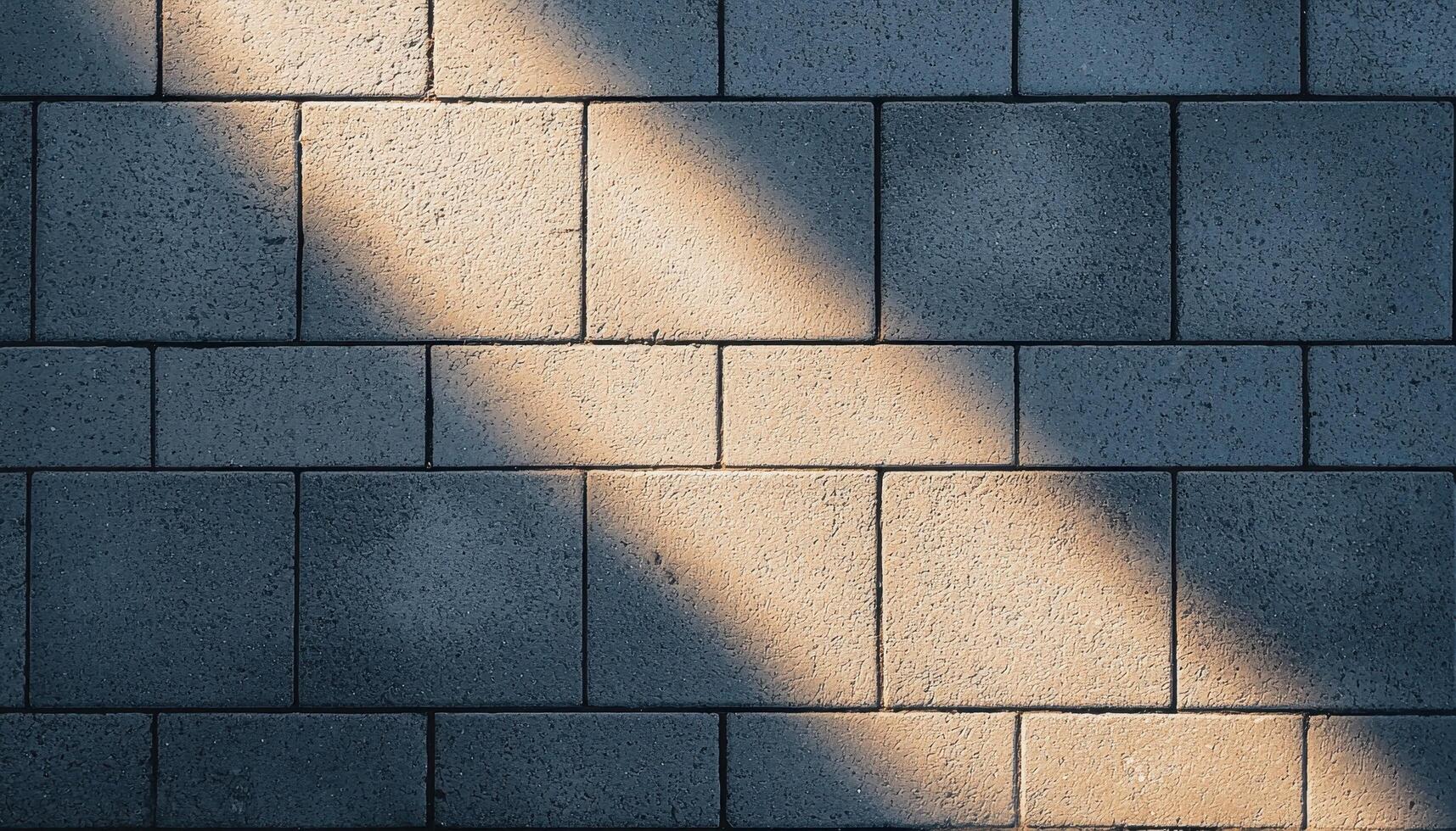 Shadows and light play on minimalist sidewalk urban setting photography daytime ground level photo