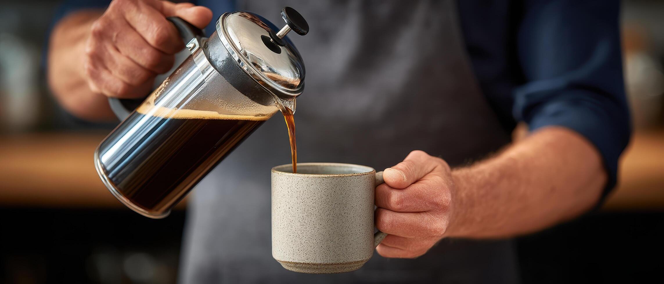 Barista pouring coffee from french press into ceramic mug coffee shop lifestyle indoor close-up photo
