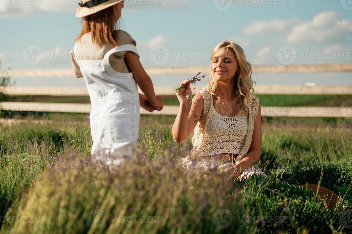 Present ,for ,woman, little flowers. Beautiful mother with her daughter on the farm photo