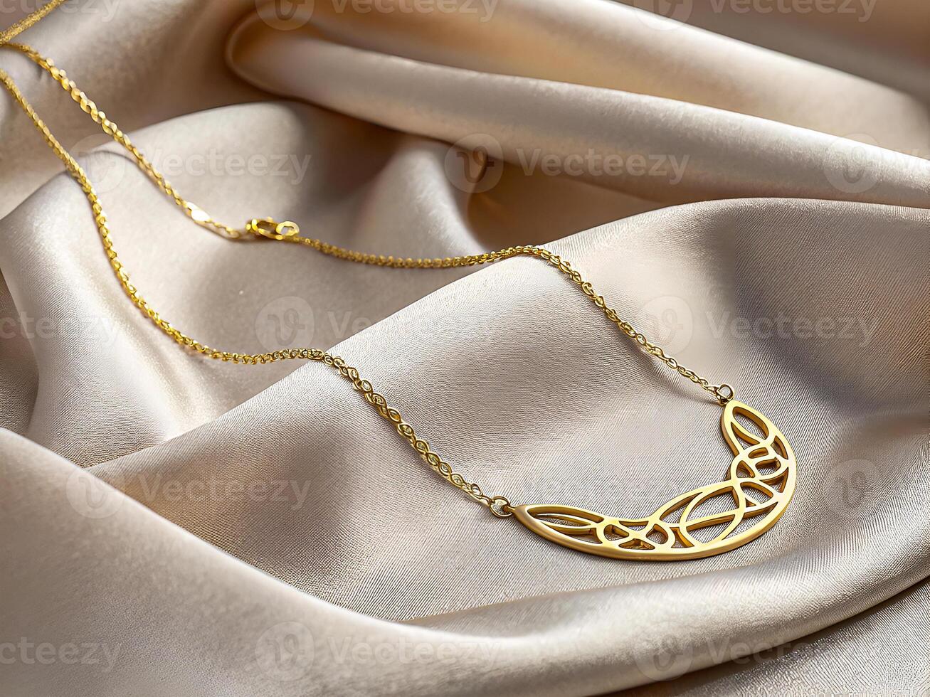 Elegant Gold Necklace on Luxurious Satin Fabric photo