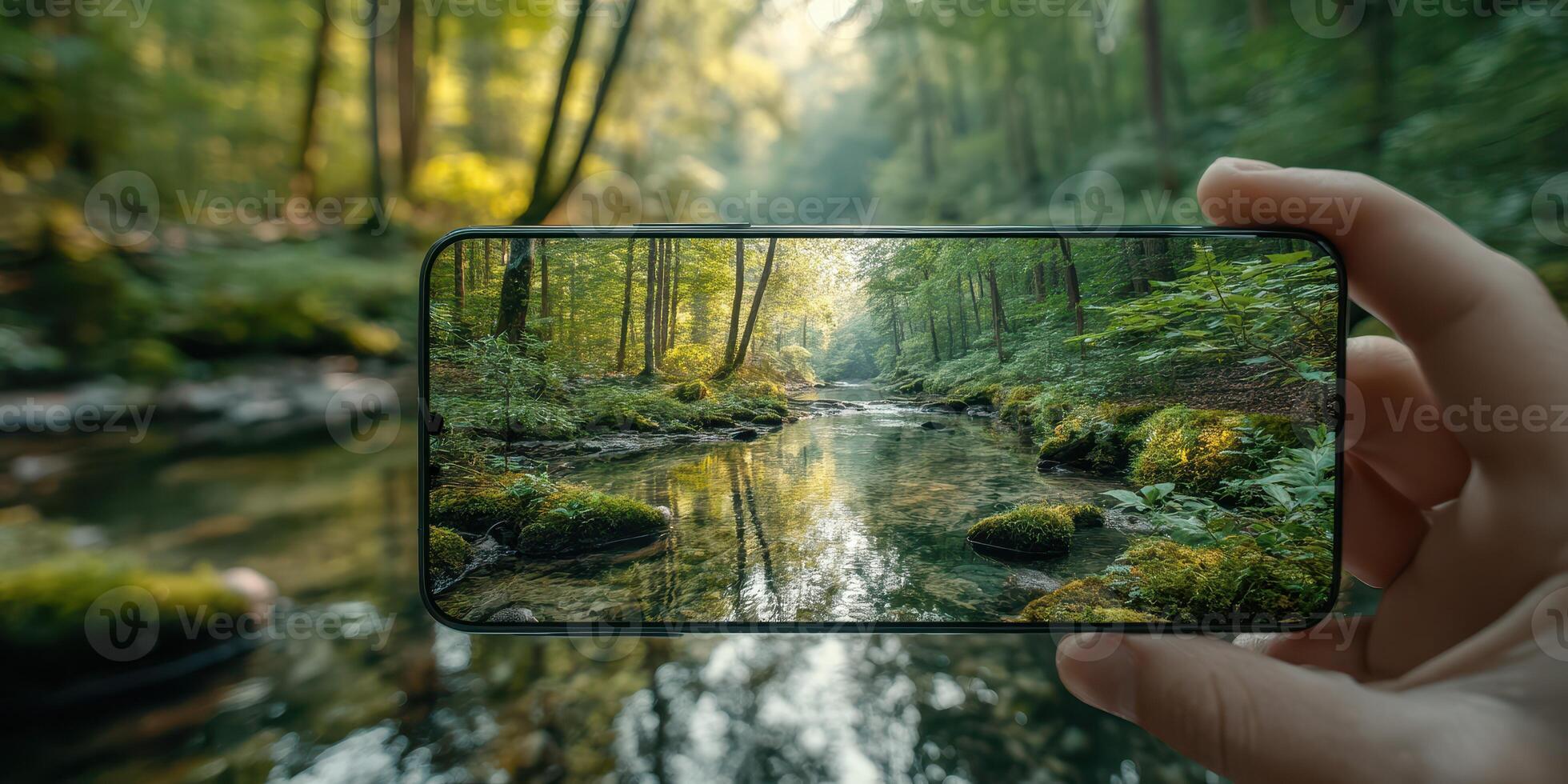 Capturing the serene beauty of a forest stream on a smartphone during a sunny afternoon photo