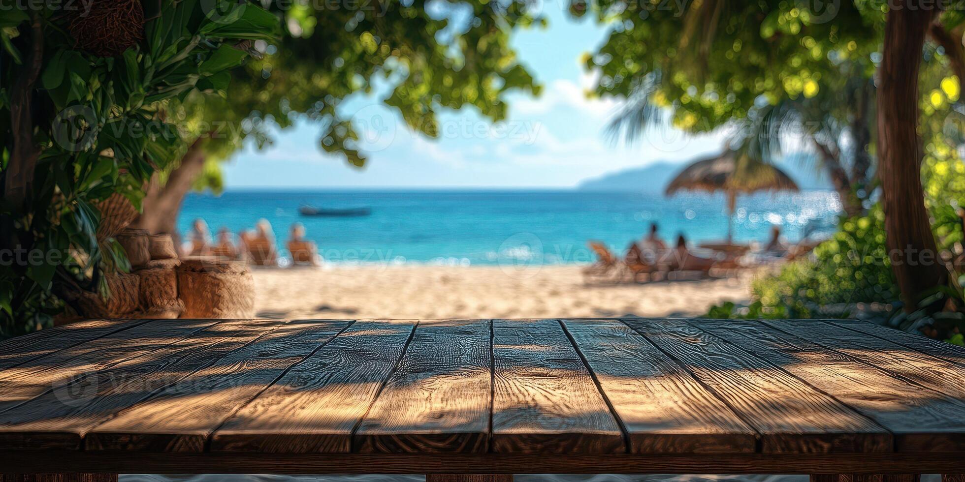 Relaxing beachfront view with a rustic wooden table under the shade on a sunny day near clear water photo
