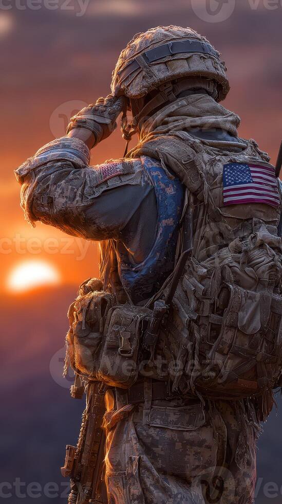 Soldier salutes the sunset while standing on a mountain, honoring duty and sacrifice in a moment of reflection photo