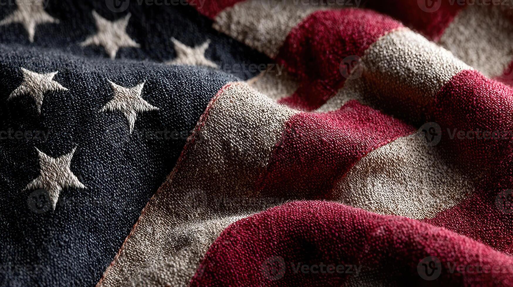 American flag fabric draped in folds with a weathered and textured appearance showcasing deep colors and stars photo