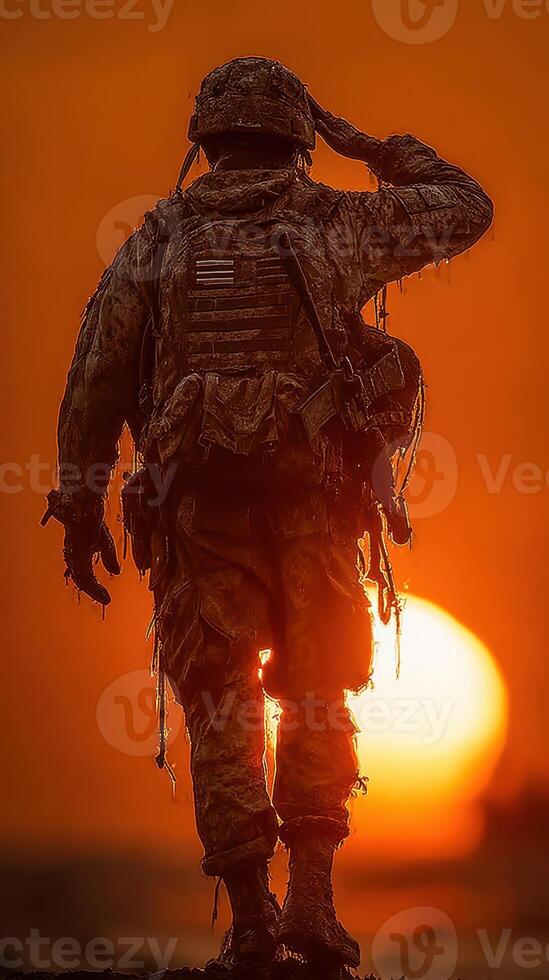 Soldier saluting at sunset on a military mission in a rugged environment photo