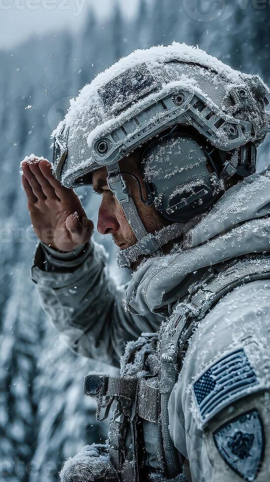 Soldier saluting in a snowy forest during winter operations at dusk photo
