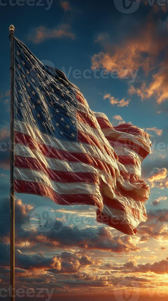 American flag waving against a colorful sunset with vibrant clouds in the background photo