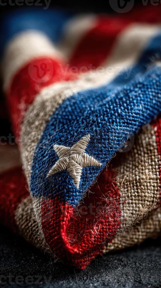Folded fabric showcasing red, white, and blue colors with a star pattern during a patriotic celebration or event photo