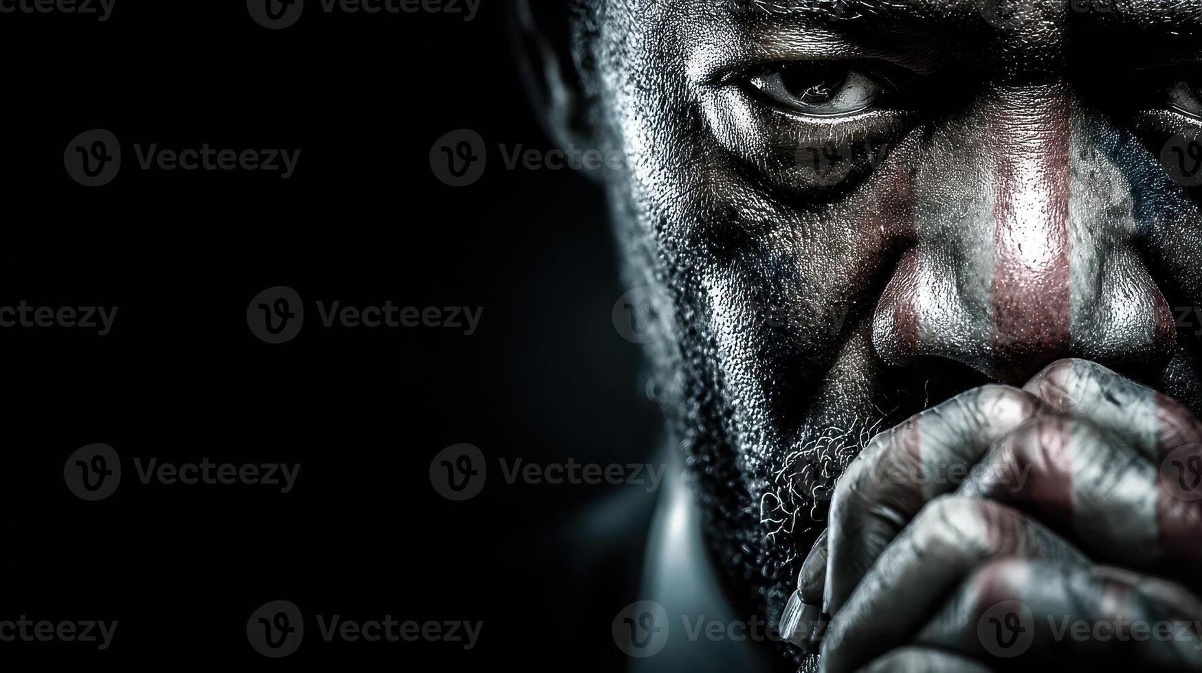 Focused expression of a man lost in thought against a dark background photo