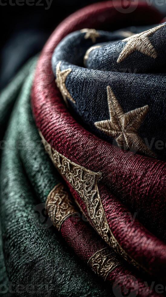 Richly textured fabric showcasing intricate patterns and colors, draped artistically in soft lighting photo