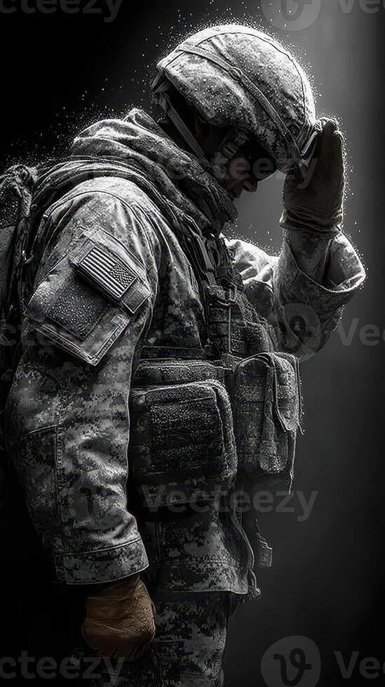 Soldier in camouflage uniform saluting with respect in a dramatic light setting photo