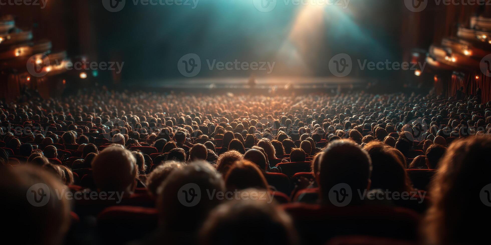 Audience enjoying a live performance in an ornate theater, the atmosphere filled with anticipation and excitement as the lights dim photo