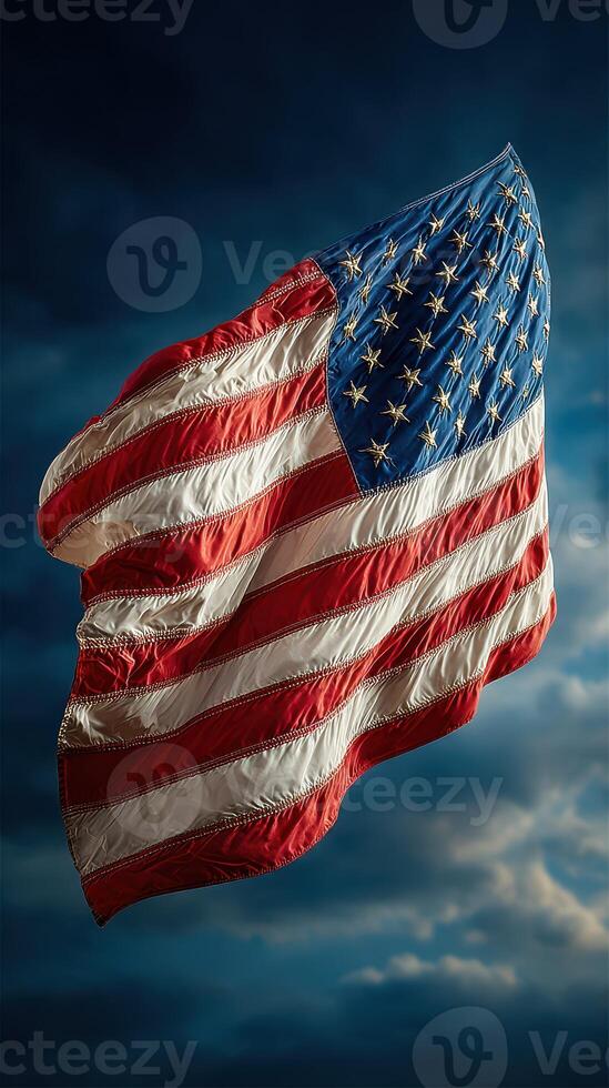 Waving American flag with vibrant colors against a dramatic cloudy sky photo