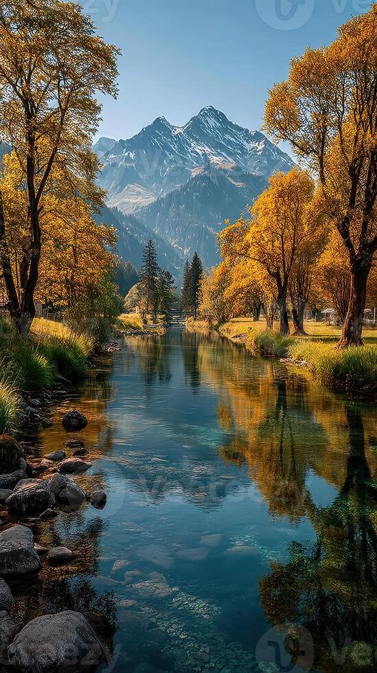 Vibrant autumn landscape with colorful trees and serene mountain reflections by a calm river photo