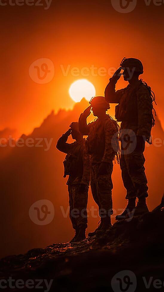 Soldiers saluting at sunset with mountains in the background during a moment of tribute photo